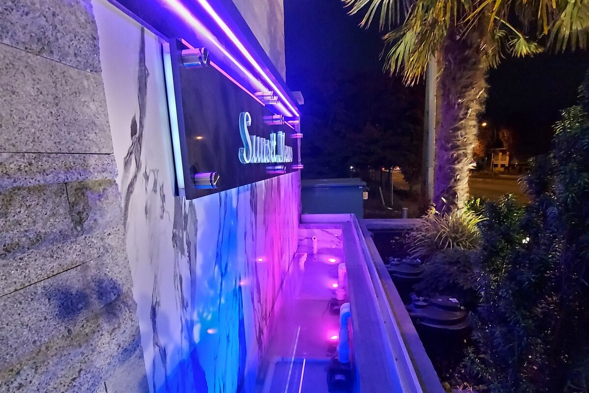A spa area with a sign reading "Sweet Temptations" and a water feature.