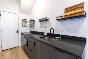 Fridge, microwave, stovetop, coffee/tea maker