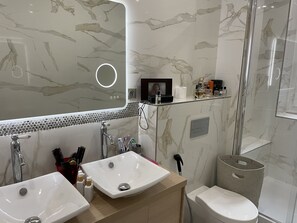 Shower, hair dryer, towels, soap