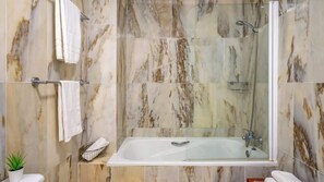 Bathtub, hair dryer, bidet, towels