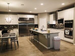 Fridge, microwave, dishwasher, cookware/dishes/utensils