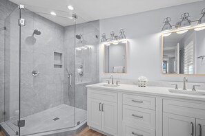 Shower, hair dryer, towels, toilet paper