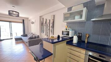 Apartment | Private kitchen | Full-size fridge, microwave, oven, stovetop