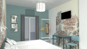 A bedroom with a bed, a desk, a chair, a wardrobe, and a TV on the wall. - Cost Mari Boutique Hotel  (Apokoronas)
