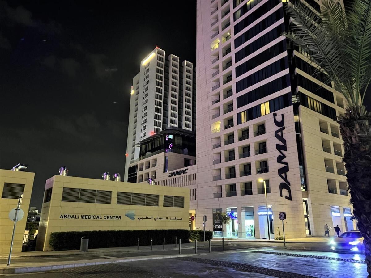 A modern building complex with the Abdali Medical Center and DAMAC buildings.