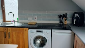Apartment, 1 Queen Bed with Sofa bed | Private kitchen | Fridge, stovetop, electric kettle, toaster