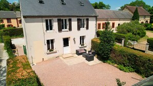 A two-story house with a paved front yard, a small garden, and a stone wall. - BIG HOUSE N°6 (Ferrières-la-Verrerie)