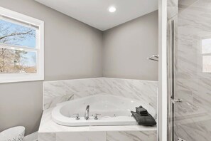 Bathtub, hair dryer, towels, soap