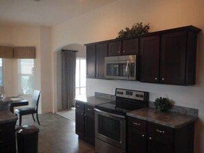 House, Multiple Beds, Lanai, Garden View | Private kitchen | Fridge, microwave, oven, stovetop