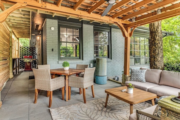 ✔ Gorgeous garden
✔ Covered gazebo with a comfortable sofa
✔ Large 50” Smart TV
✔ Outdoor dining table and gas grill
✔ Cornhole
