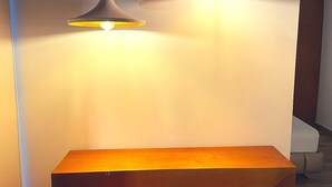 A modern interior with a wooden table and pendant lights. - Calle 76 Apto 3 by Caribecheap (Barranquilla)