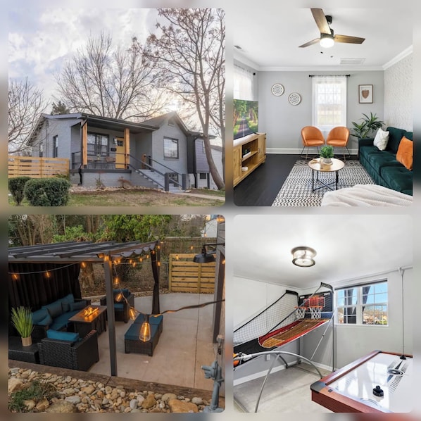 A modern house with a grey exterior, a wooden deck, and a backyard with outdoor seating and a fire pit.