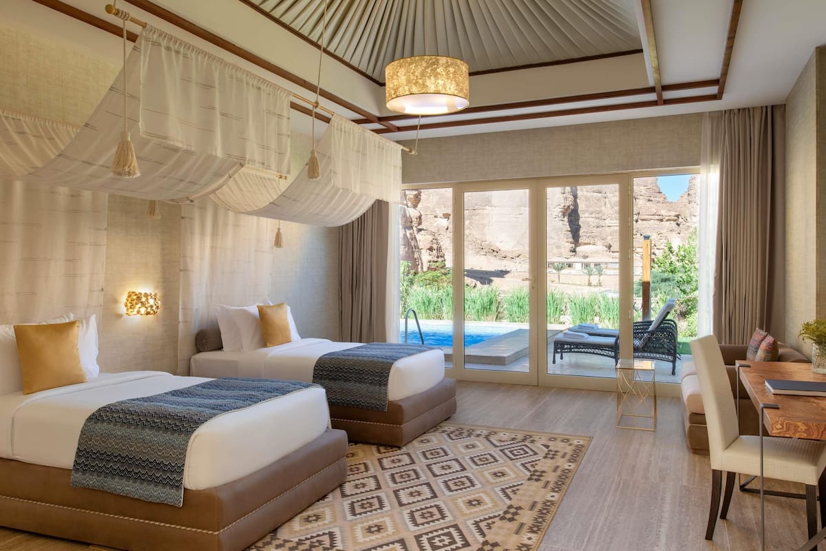Oasis Pool Villa | Minibar, in-room safe, individually decorated, individually furnished