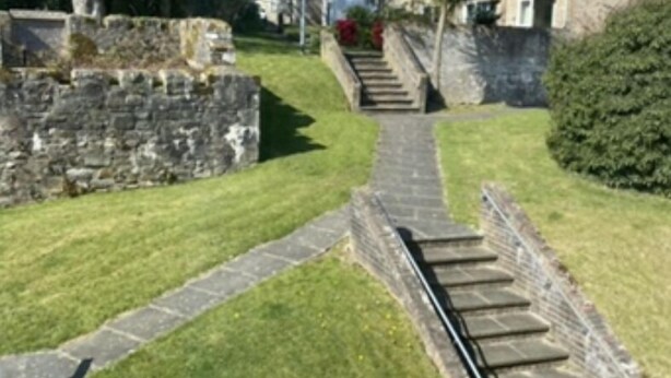 A stone pathway leading to a stone building with a staircase. - Cornish Getaway (Newquay)