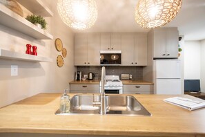 Fridge, microwave, stovetop, coffee/tea maker