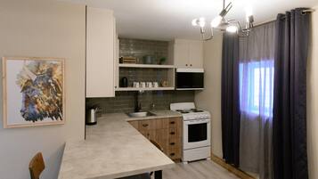 Fridge, stovetop, coffee/tea maker, dining tables