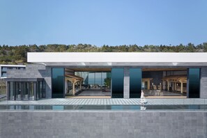 Enjoy a tranquil retreat with a clear view of the surrounding landscape from this building's spacious terrace.
