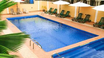 Outdoor pool, open 9:00 AM to 11:00 PM, pool umbrellas, pool loungers