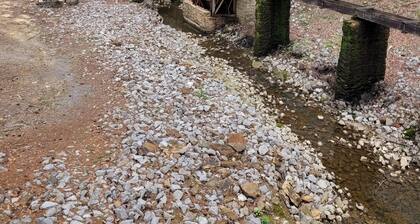 Historic Cabin in a natural setting with waterfalls and covered bridge