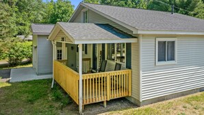 A two-story house with a porch, a small deck, and a visible number '225' on the front. - Higgins Hideout *3 minute drive to the beach* (Roscommon)