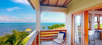 Tropical retreat with a pool, dock, bikes, canoes, balconies, and 360 views