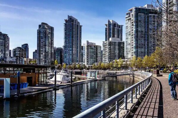 Stroll along the riverfront walkway and take in the city's vibrant urban landscape.