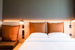 Hypo-allergenic bedding, desk, laptop workspace, blackout drapes