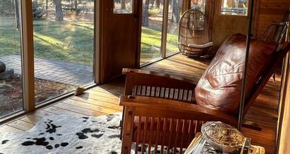 Wooden A-Frame Cabin Nestled in the Tall Pines