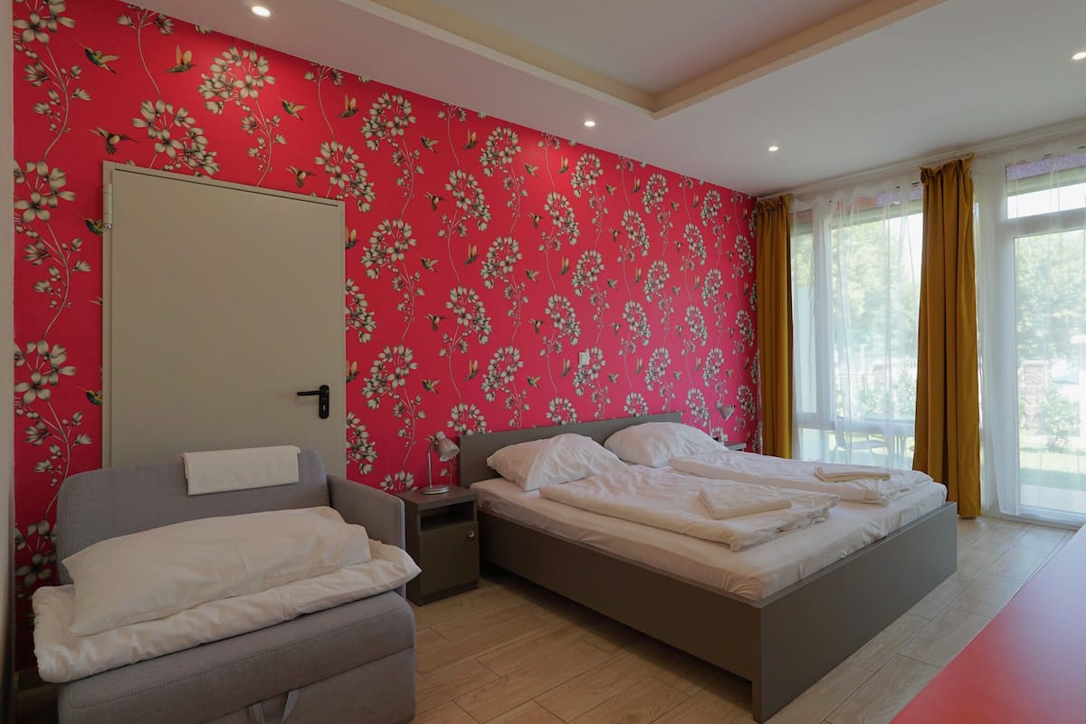 Comfort Triple Room | Minibar, in-room safe, desk, iron/ironing board