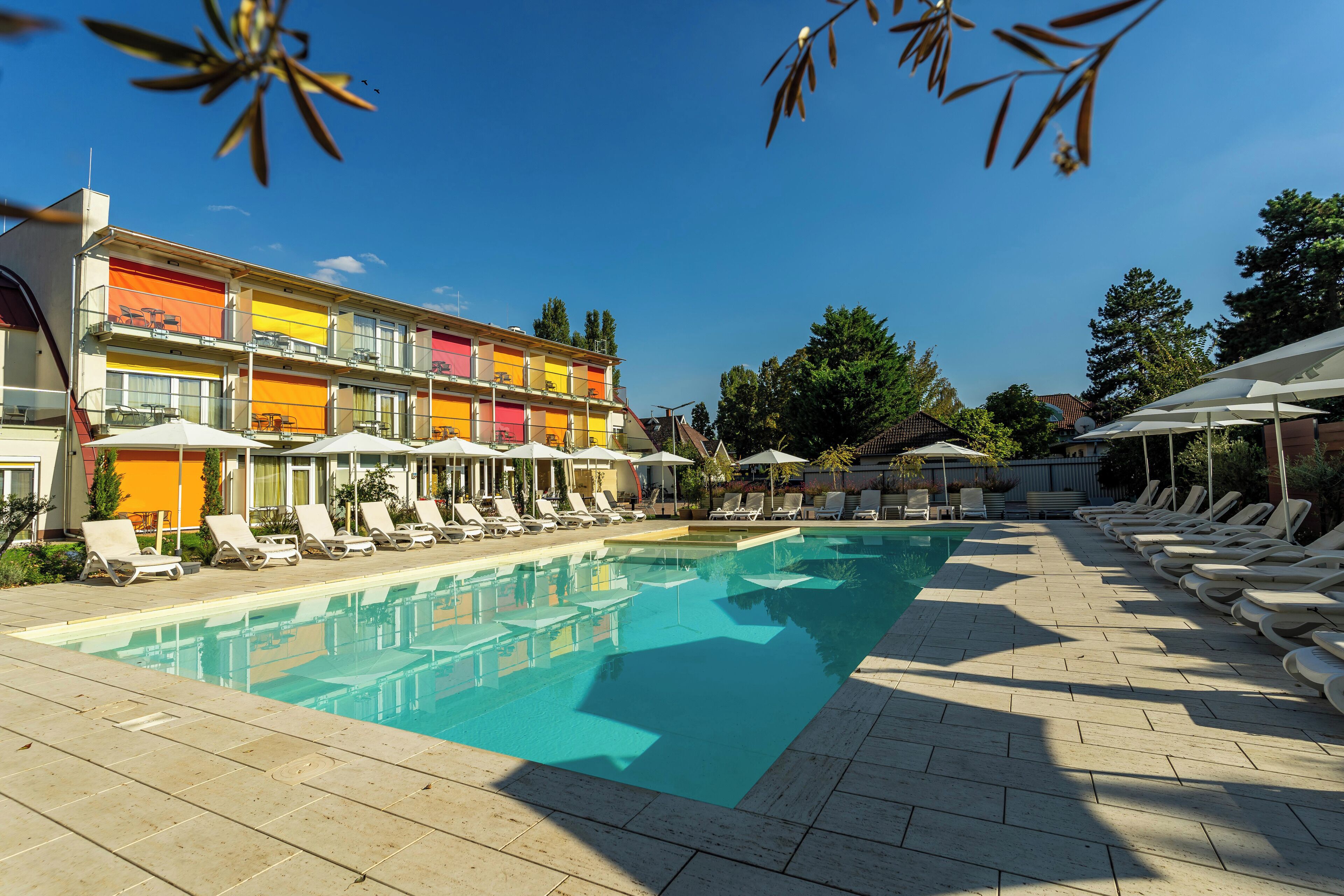 Seasonal outdoor pool, open 9:00 AM to 9:00 PM, pool umbrellas