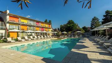 Seasonal outdoor pool, open 9:00 AM to 9:00 PM, pool umbrellas