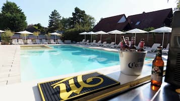 Relax by the pool with a refreshing drink in hand.