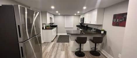 Coffee/tea maker, fridge, microwave, oven