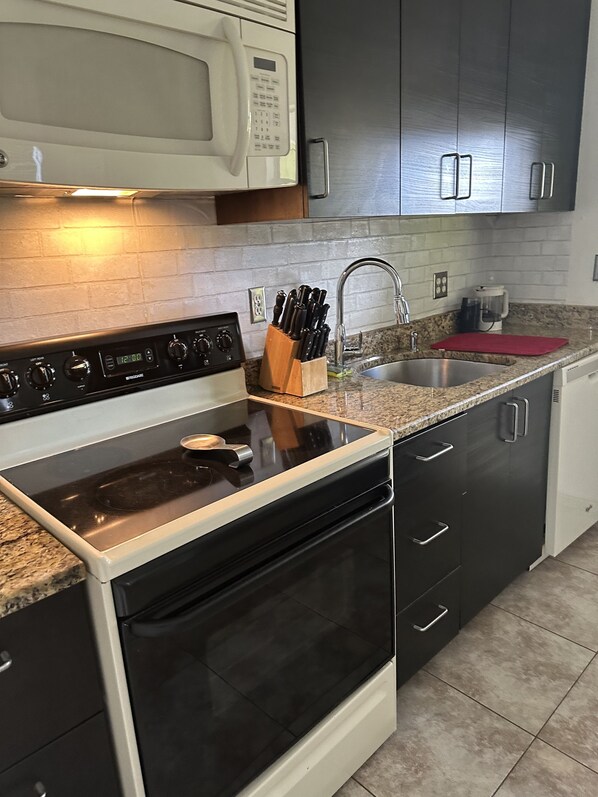 Fridge, microwave, oven, stovetop - This home has 2 bedrooms and 1 bath with a huge backyard. (Tampa)