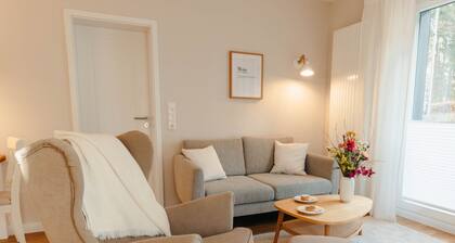 The vacation apartment with three terraces is located between the forest and the lake