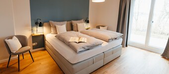 The vacation apartment with three terraces is located between the forest and the lake