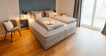 The vacation apartment with three terraces is located between the forest and the lake