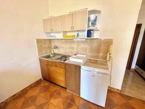 Fridge, stovetop, cookware/dishes/utensils