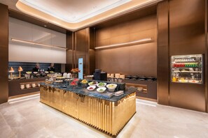 A modern breakfast bar with a variety of food options, a coffee station, and a beverage refrigerator. - Crystal Orange Hotel Haimen Wenfeng Great World (Nantong)