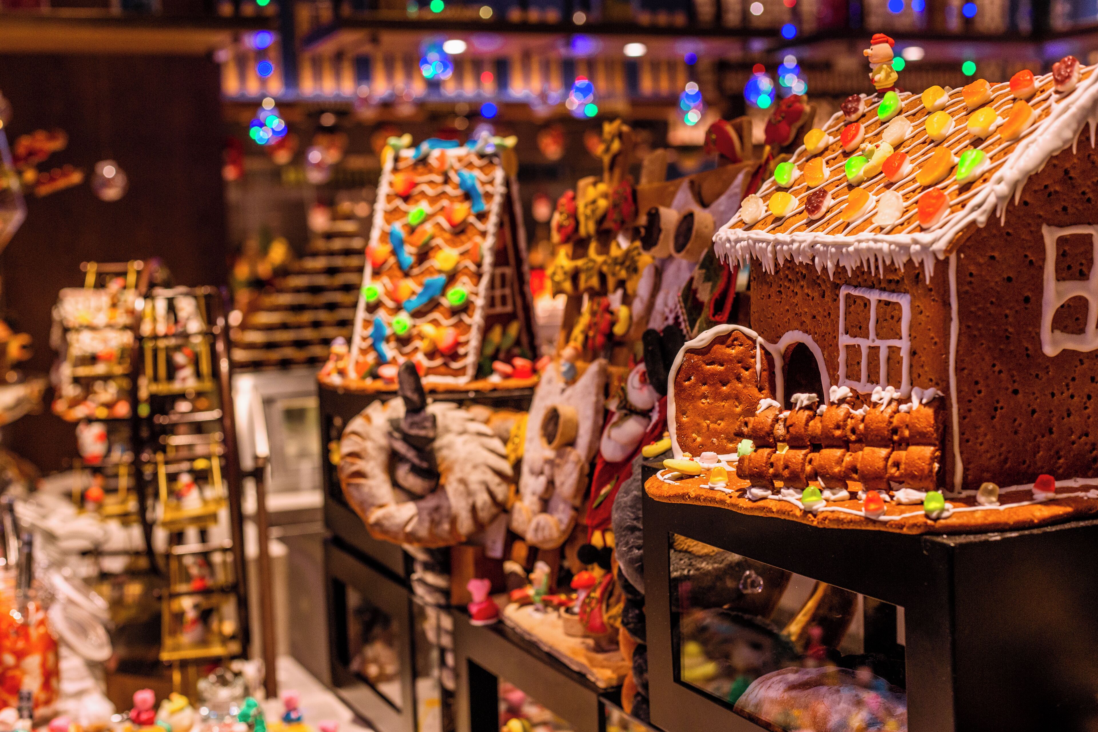 A gingerbread house display with various decorations and ornaments.