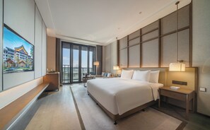 Deluxe-rum - 1 kingsize-säng - utsikt mot trädgården | Sängtillbehör av högsta kvalitet, duntäcken och minibar