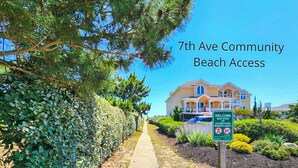 A pathway leading to a beach with a large house in the background and a sign indicating beach access. - Pittsport - Begin your next great Outer Banks vacation in this 4 BR, oceanside home! (Southern Shores)