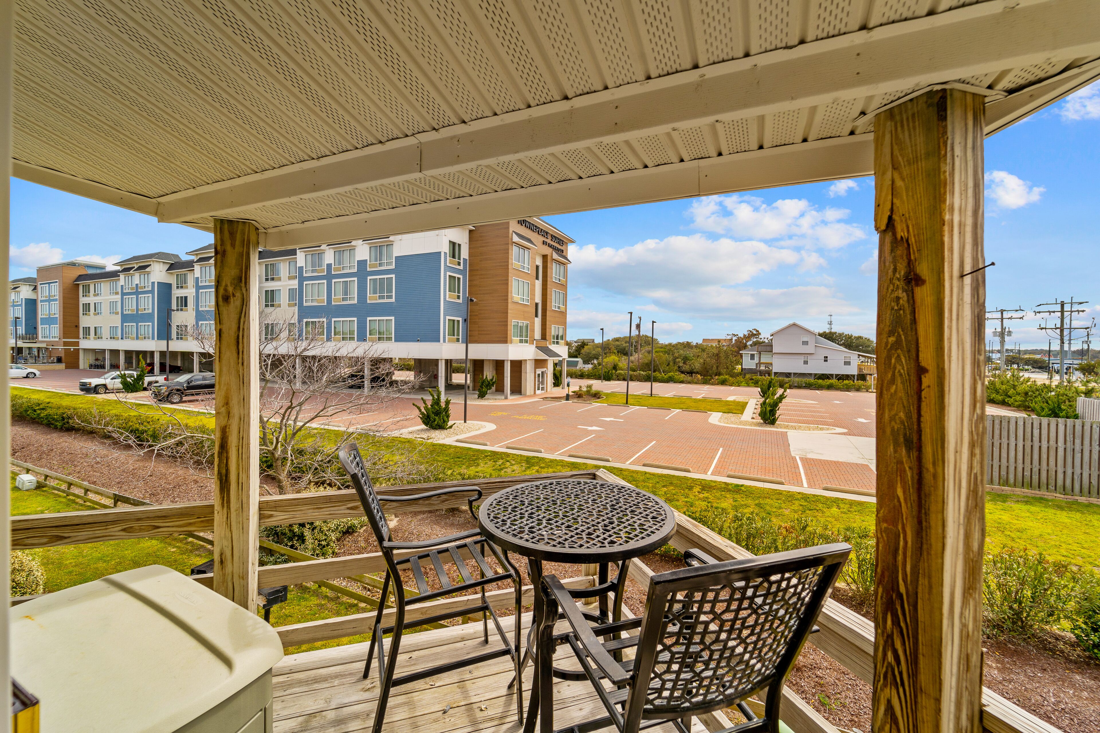 Modern condo on the coast with beach, pool, & grill access - private deck and AC