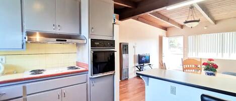 Family Apartment | Private kitchen | Fridge, microwave, stovetop, coffee/tea maker