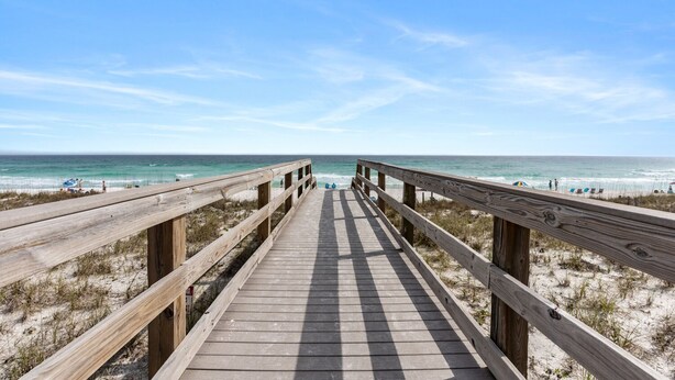 A wooden boardwalk leading to a beach with clear skies. - Sunray - Gulf-side townhouse, beach access & pool (Navarre)