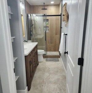 Shower, hair dryer, towels, soap