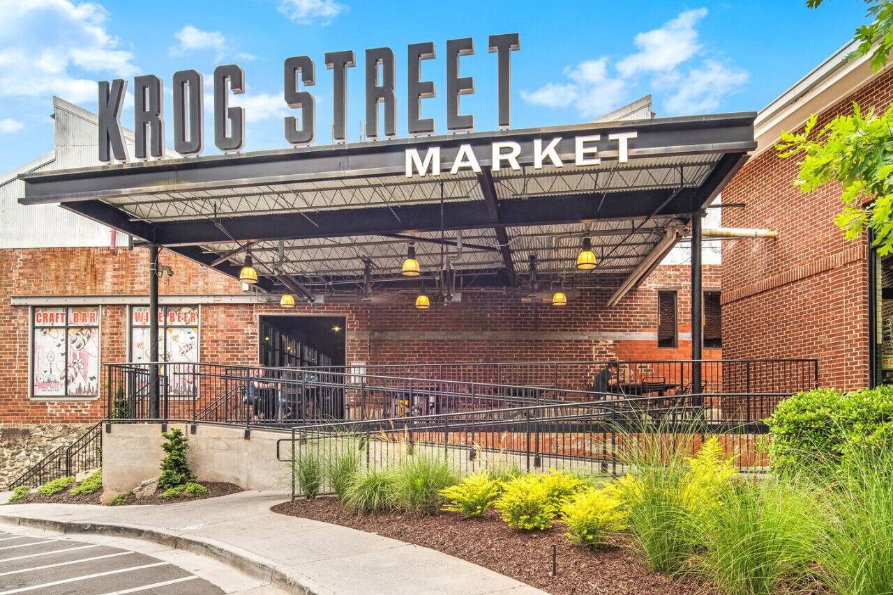 Krog Street Market with a brick facade, outdoor seating, and a covered entrance.