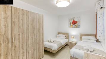 Desk, iron/ironing board, travel crib, WiFi (free)