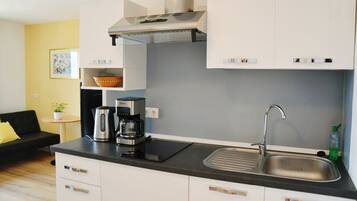 Fridge, microwave, stovetop, coffee/tea maker