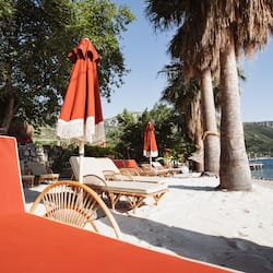 On the beach, sun loungers, beach umbrellas, beach towels